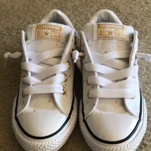 White All Star Converse with small gold stars